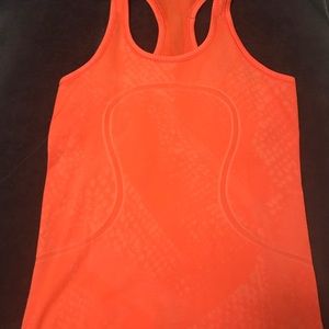 Lululemon orange racerback. Size 8.